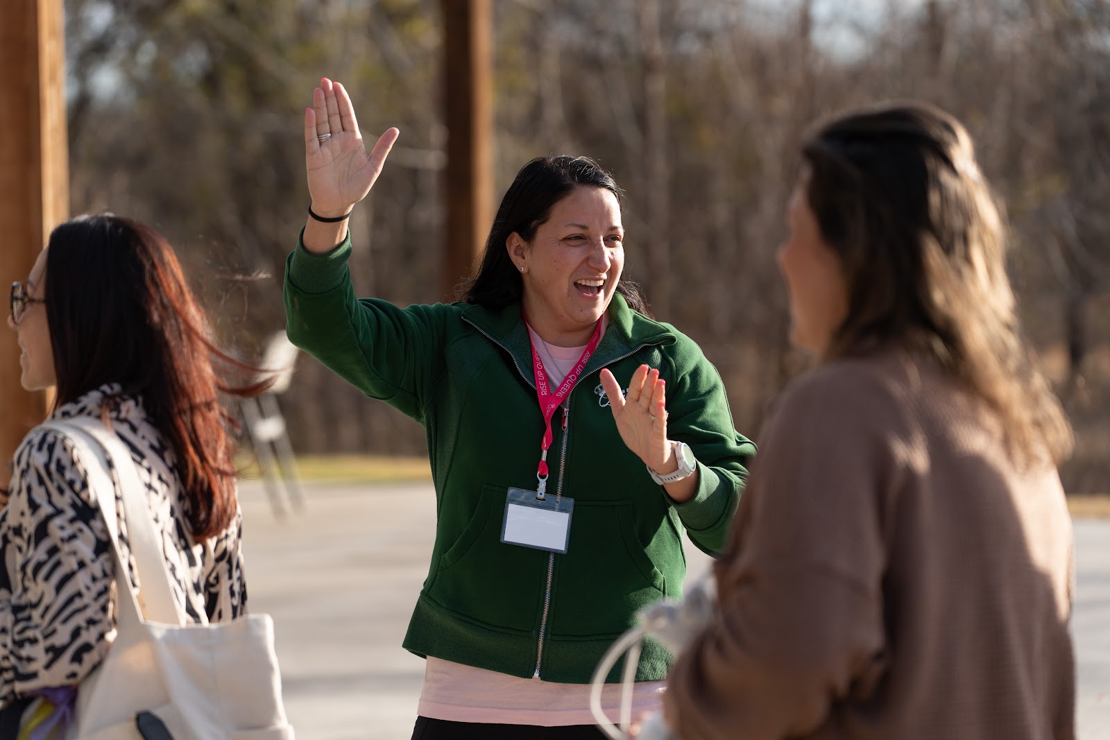 A woman warmly greeting a friend