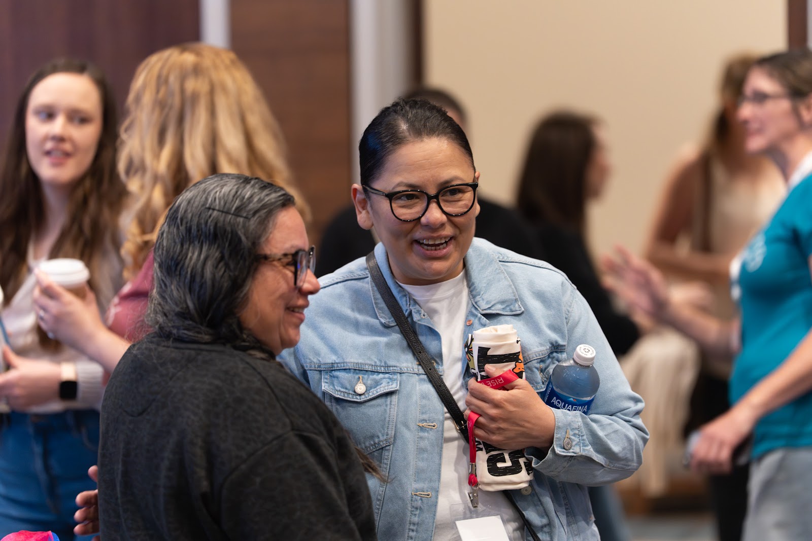 Women laughing together in conversation