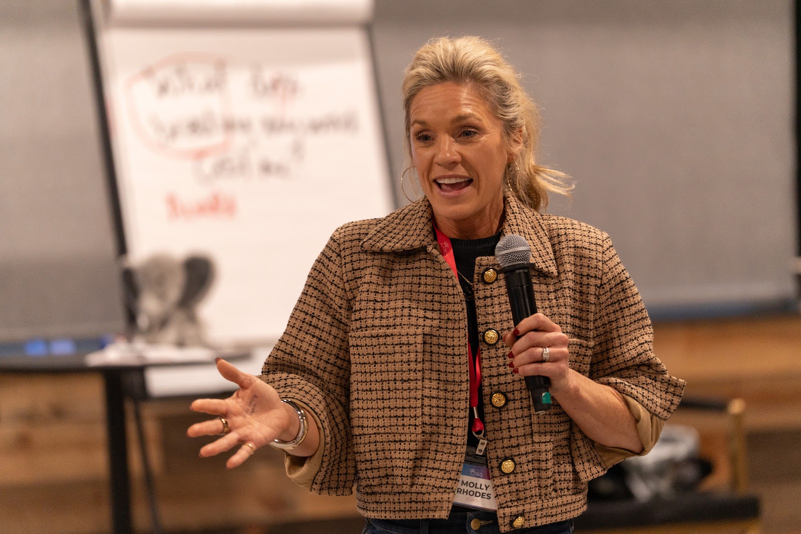 A woman teaching with warmth and confidence